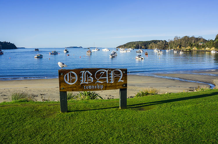 Welcome to Oban sign on Stewart Island beach